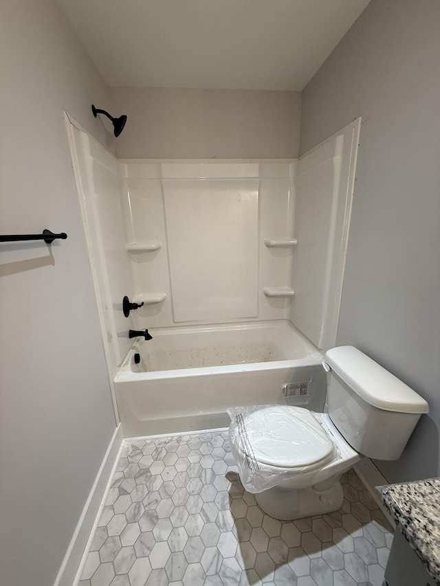 bathroom featuring shower / tub combination, tile patterned floors, and toilet