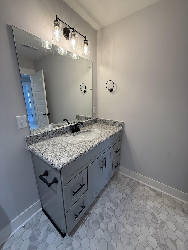 bathroom featuring tile patterned floors and vanity