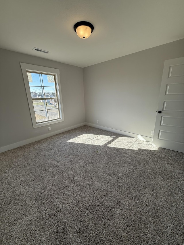 empty room featuring carpet floors