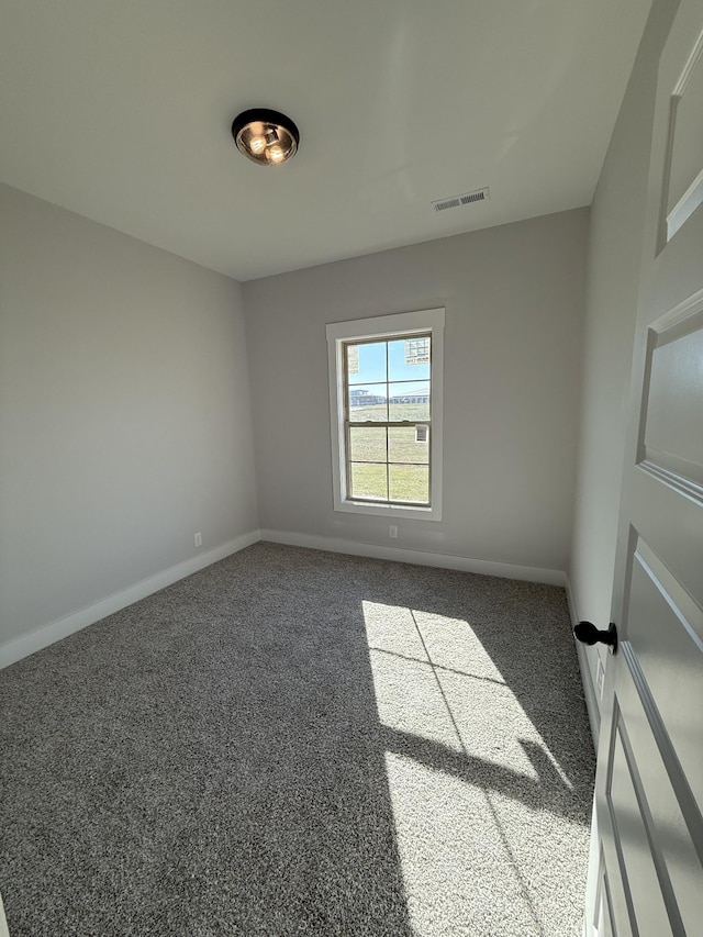 empty room featuring carpet flooring