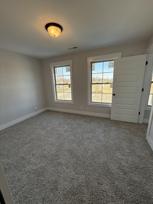 view of carpeted spare room