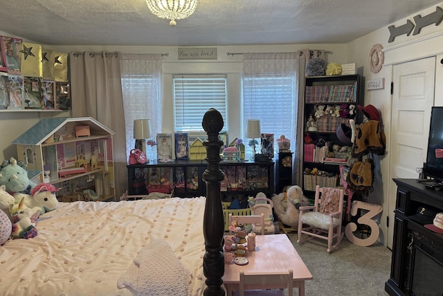 bedroom with a textured ceiling and carpet