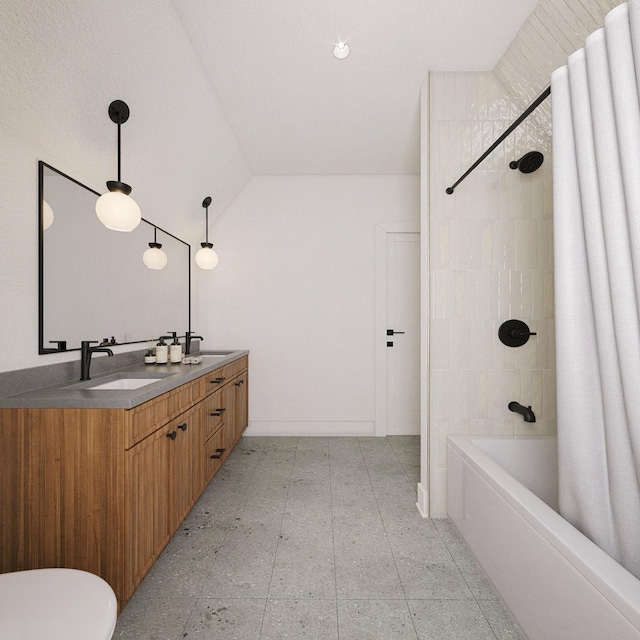 bathroom featuring vaulted ceiling, shower / tub combo with curtain, and vanity