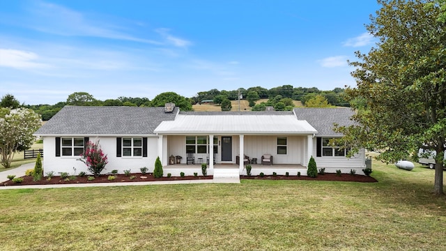 single story home with a porch and a front yard