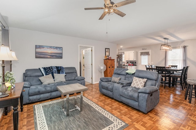 living room with parquet floors and ceiling fan