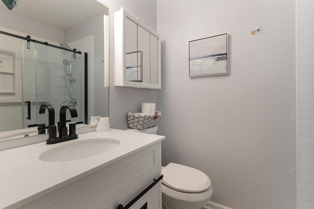 bathroom featuring toilet, a shower with door, and vanity