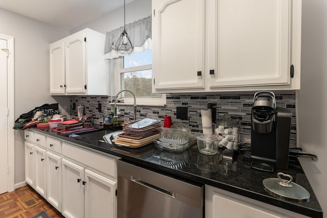 kitchen with decorative light fixtures, white cabinetry, dishwasher, dark stone counters, and dark parquet flooring