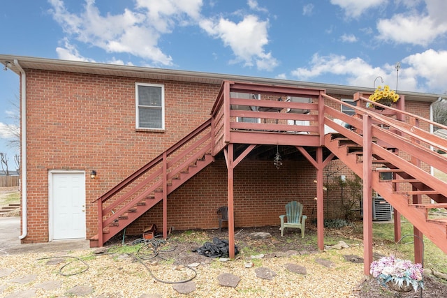 back of property with a wooden deck