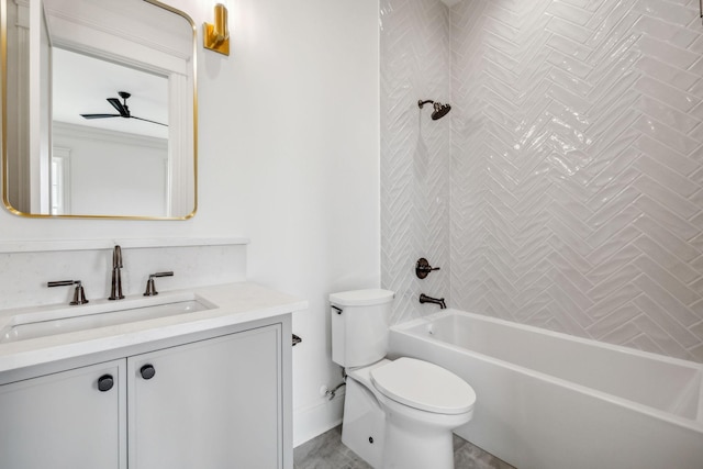 full bathroom featuring toilet, tiled shower / bath, and vanity