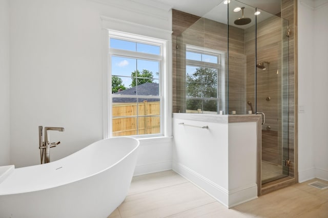 bathroom featuring separate shower and tub and tile patterned floors