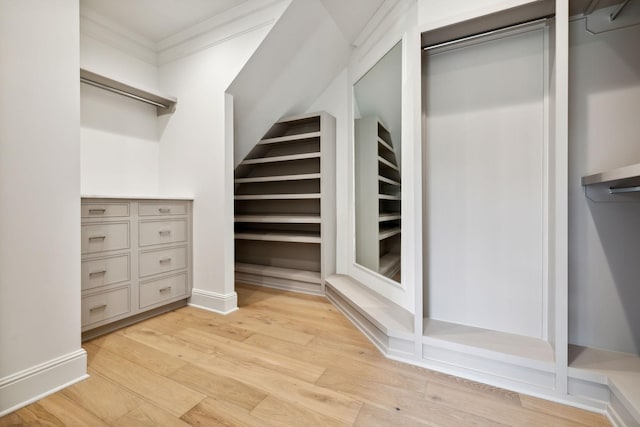 spacious closet featuring light hardwood / wood-style floors