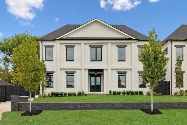 view of front of home featuring french doors and a front yard