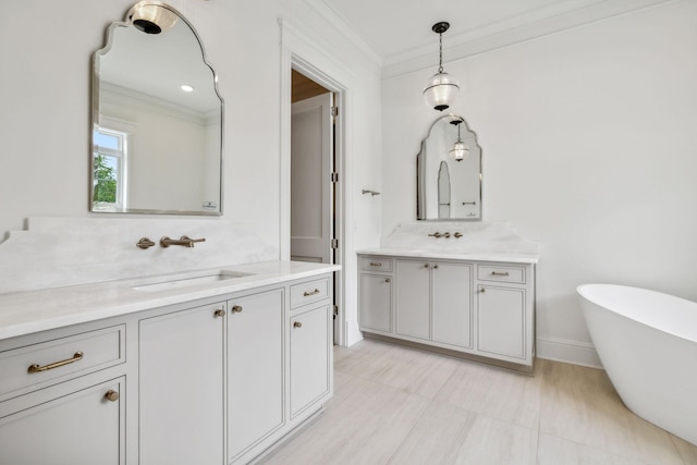 bathroom featuring vanity, crown molding, and a bath