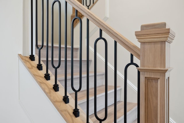 staircase featuring hardwood / wood-style floors