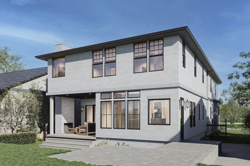 rear view of house featuring a patio area, an outdoor living space, and a yard