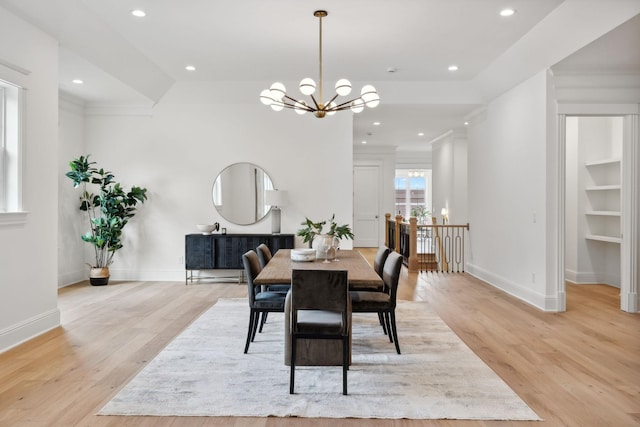 dining room with an inviting chandelier and light wood-type flooring