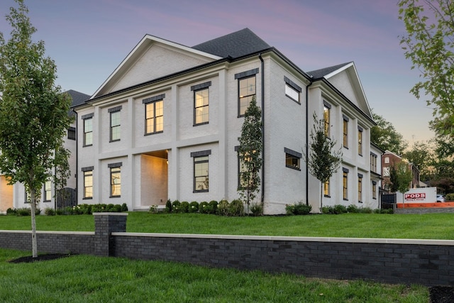 view of front of house with a yard