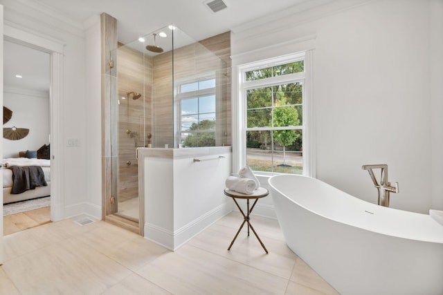 bathroom with tile patterned flooring and independent shower and bath