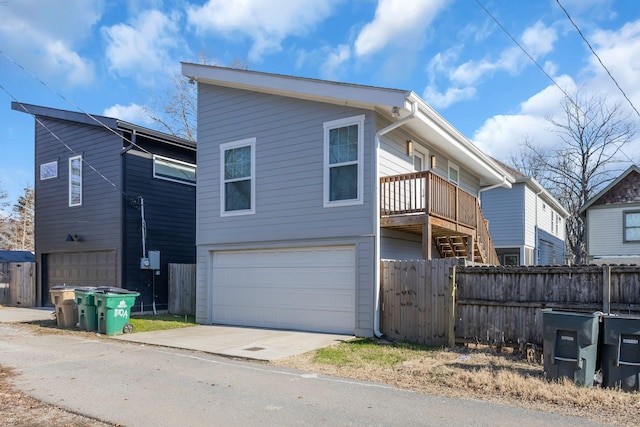 exterior space with a balcony and a garage