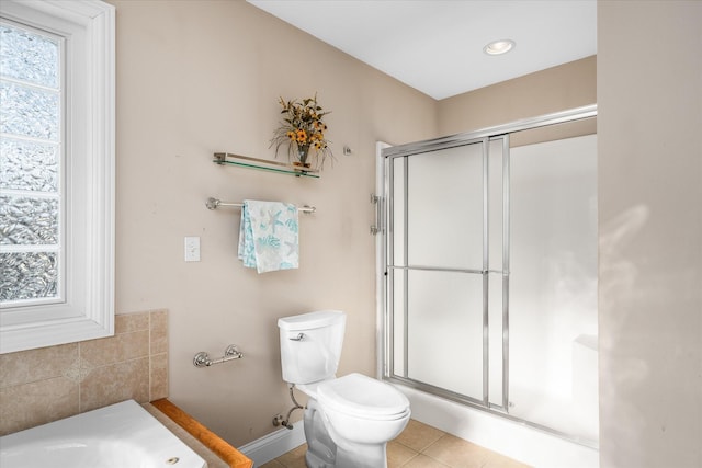 bathroom with toilet, an enclosed shower, tile patterned floors, and plenty of natural light