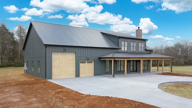 view of front facade featuring covered porch and a garage