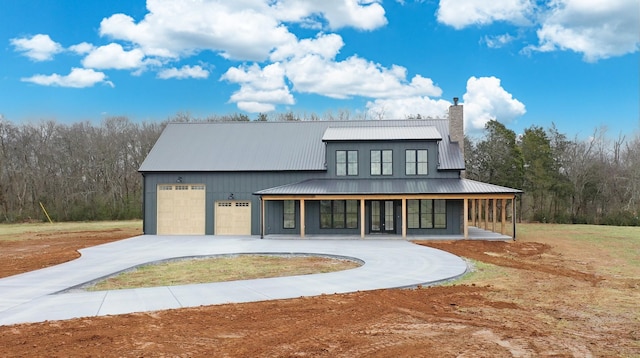 exterior space featuring a porch and a garage