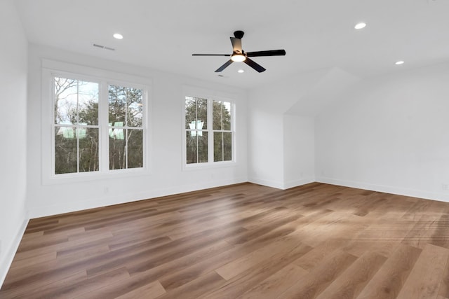 additional living space with ceiling fan and light wood-type flooring