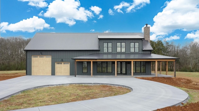 view of front facade featuring a porch and a garage