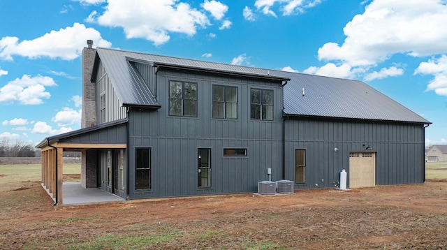 rear view of property with a patio and cooling unit