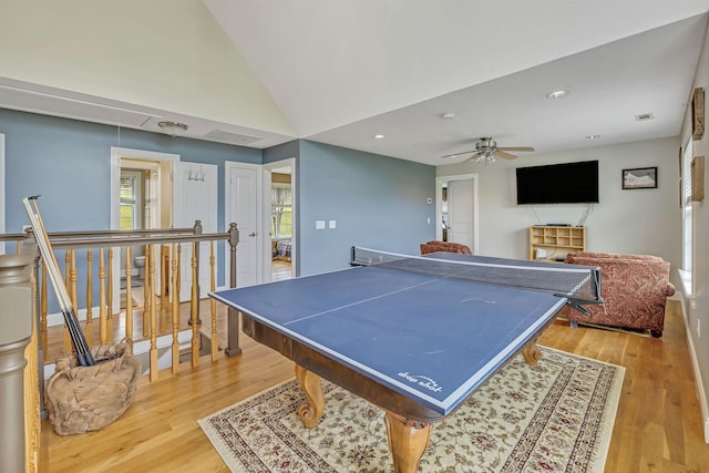 rec room featuring lofted ceiling, light wood-type flooring, and ceiling fan