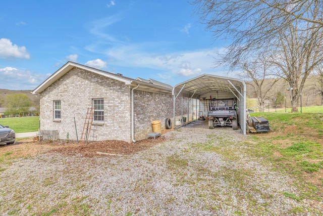 view of property exterior with a lawn and a carport