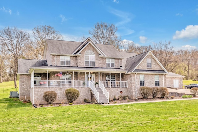 view of front of property with a porch and a front lawn