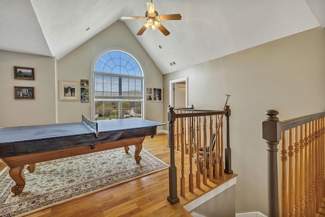 game room featuring lofted ceiling, ceiling fan, and light hardwood / wood-style floors