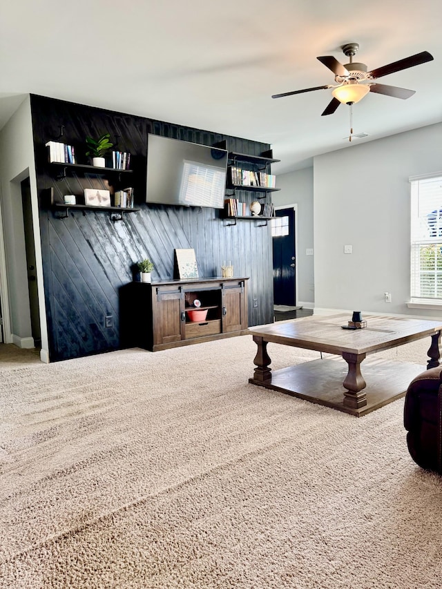 exercise room featuring carpet flooring and ceiling fan