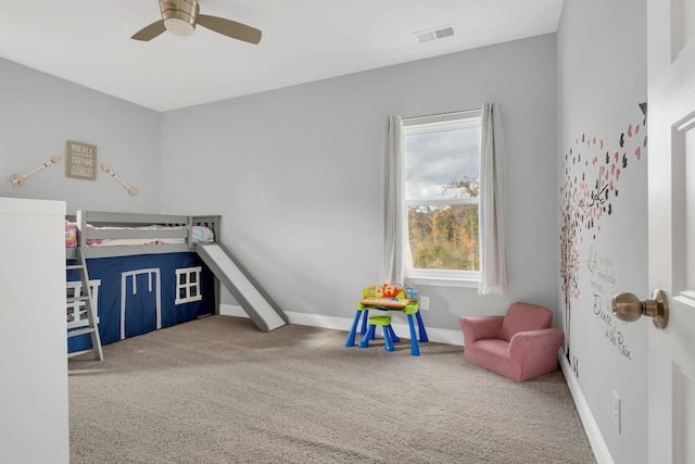 bedroom with ceiling fan and carpet