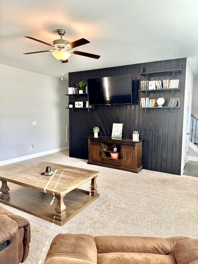 living room with carpet flooring and ceiling fan