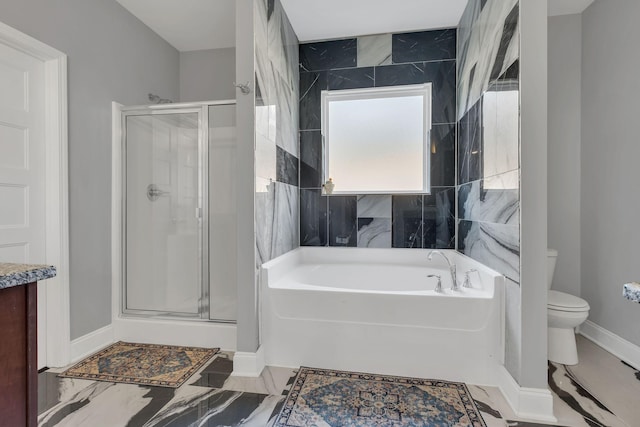 bathroom featuring separate shower and tub and toilet