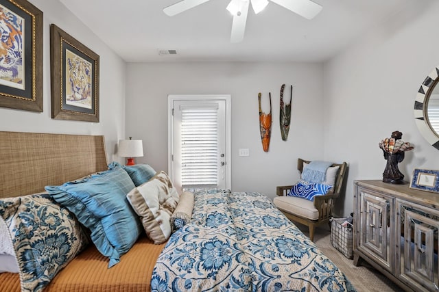 bedroom featuring ceiling fan and light carpet