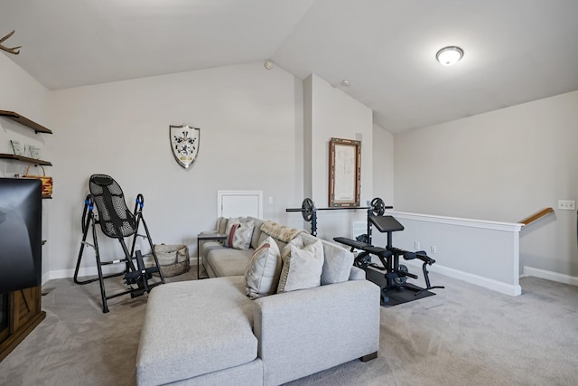 workout area featuring light colored carpet and lofted ceiling