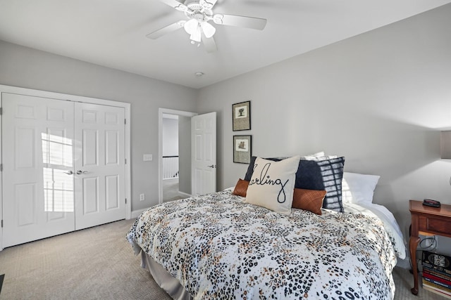 bedroom featuring a closet, ceiling fan, and light carpet