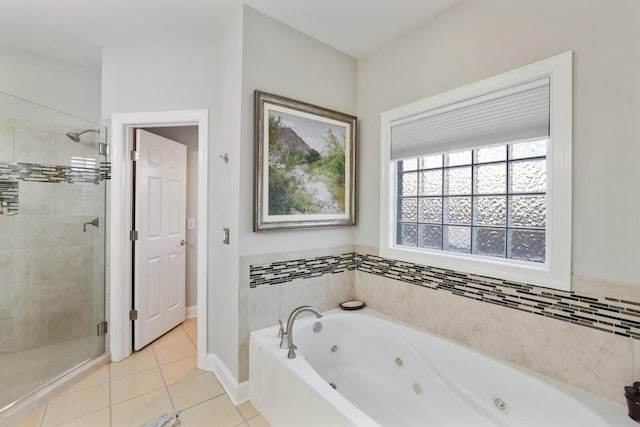 bathroom with tile patterned flooring and independent shower and bath