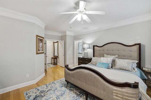 bedroom with ornamental molding, ceiling fan, and light hardwood / wood-style flooring