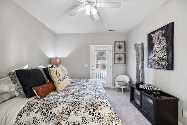 bedroom featuring light carpet and ceiling fan