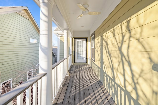 wooden deck with ceiling fan