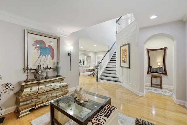 interior space with crown molding and hardwood / wood-style flooring