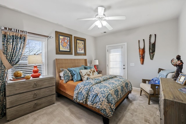 bedroom with ceiling fan and light colored carpet