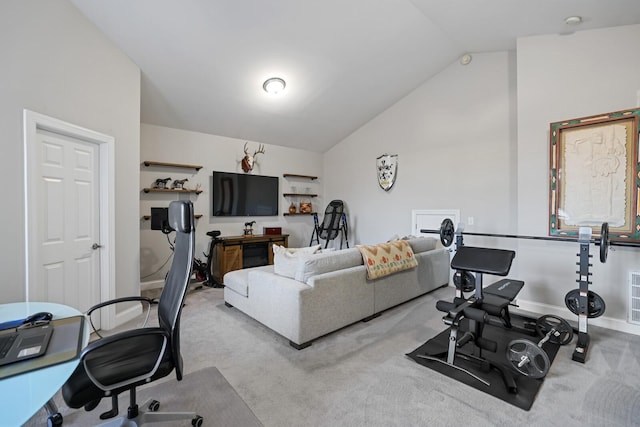 carpeted living room with lofted ceiling