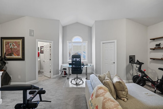 carpeted bedroom featuring ensuite bathroom and vaulted ceiling