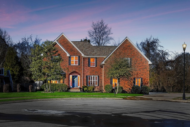 view of front of home featuring a yard