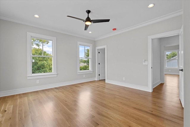 spare room with ceiling fan, light hardwood / wood-style floors, and crown molding